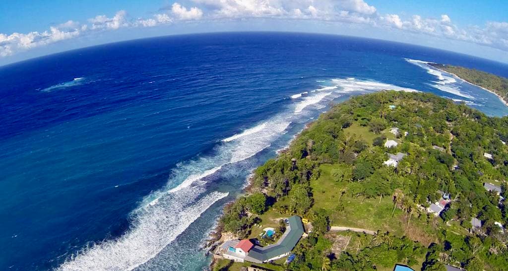 Wide aerial view of Blue Pango Guesthouse and Havannah Harbour